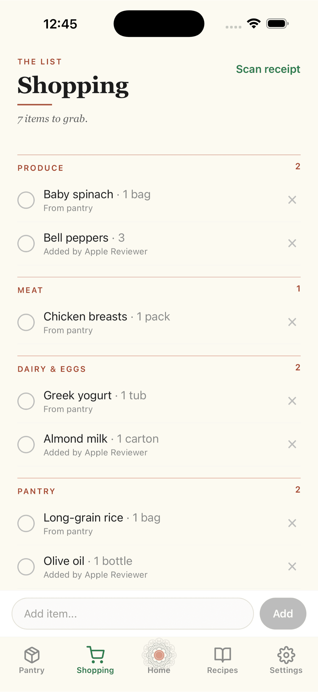 Shopping list grouped by aisle with attribution showing which member added each item